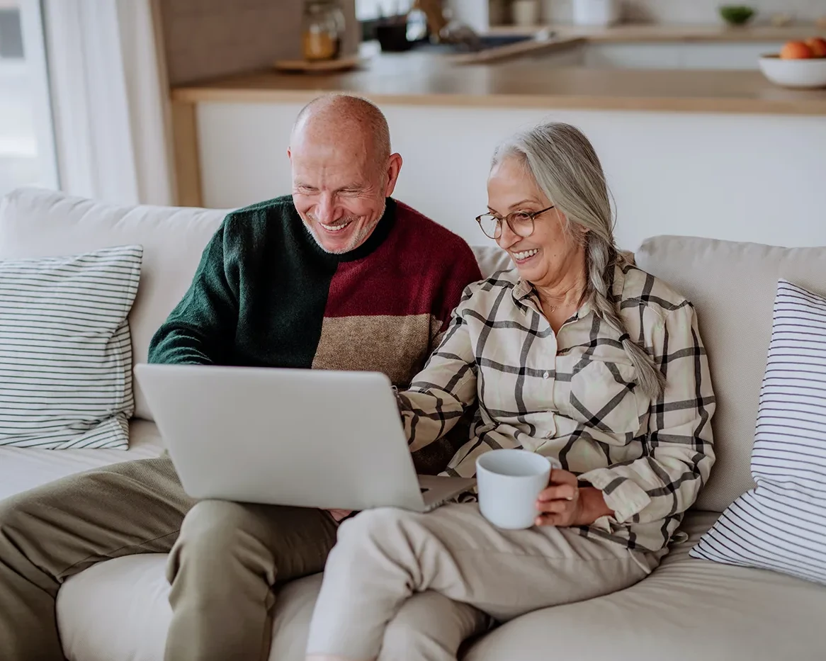 A photo of a couple looking to refinance their home loan