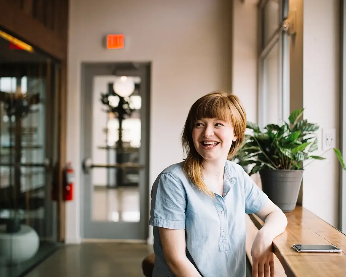 A photo of a young medical professional relaxing in a coffee shop